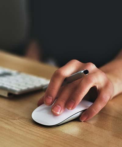 Hand on computer mouse